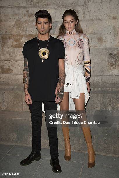 Zayn Malik and Gigi Hadid attend the Givenchy show as part of the Paris Fashion Week Womenswear Spring/Summer 2017 on October 2, 2016 in Paris,...