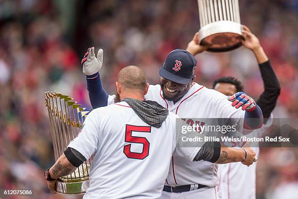 Former Boston Red Sox left fielder Jonny Gomes greets David Ortiz of the Boston Red Sox during an honorary retirement ceremony in his final regular...