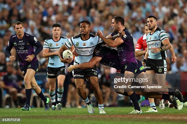 Ben Barba of the Sharks is tackled during the 2016 NRL Grand Final match between the Cronulla Sharks and the Melbourne Storm at ANZ Stadium on...