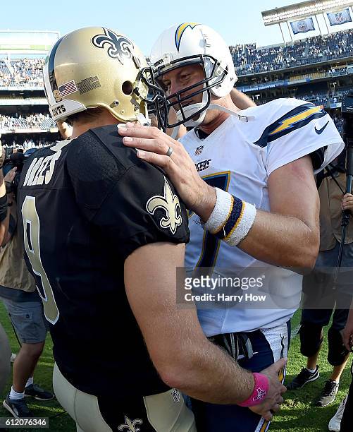 Philip Rivers of the San Diego Chargers speaks with Drew Brees of the New Orleans Saints after a 35-34 come from behind Saints win at Qualcomm...