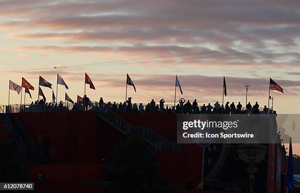 Chaska, MN, USA; Fans wait in the grandstands on the first tee as the sun comes up before the Day 2 morning matches for the 2016 Ryder Cup at...