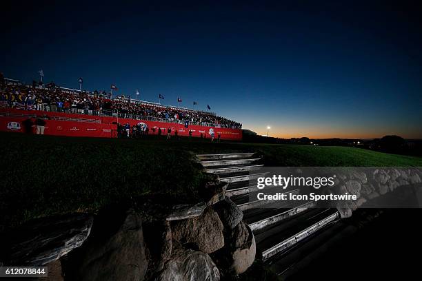 Chaska, MN, USA; Fans wait in the grandstands on the first tee as the sun comes up before the Day 2 morning matches for the 2016 Ryder Cup at...