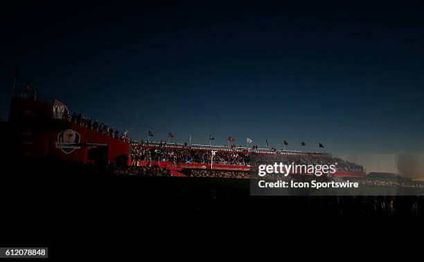 Chaska, MN, USA; Fans wait in the grandstands on the first tee as the sun comes up before the Day 2 morning matches for the 2016 Ryder Cup at...