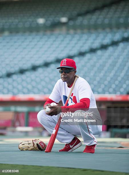 Infield coach Alfredo Griffin of the Los Angeles Angels of Anaheim watches batting practice before the game against the Oakland Athletics at Angel...