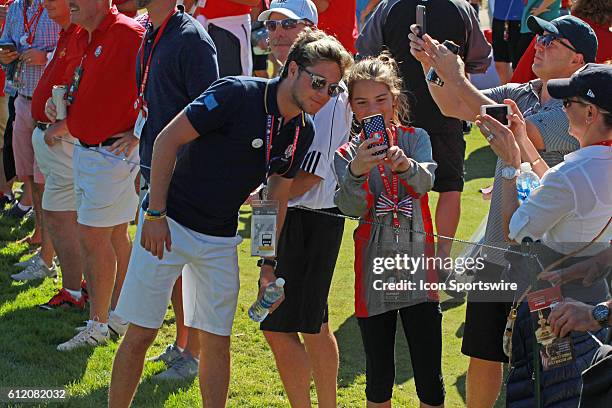 Chaska, MN, USA; One Direction singer Niall Horan poses for a selfie photo with a fan during the Day 3 Final Round matches for the 2016 Ryder Cup at...