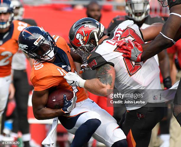 Denver Broncos wide receiver Jordan Norwood gets wrapped up by Tampa Bay Buccaneers strong safety Chris Conte during the fourth quarter October 2,...