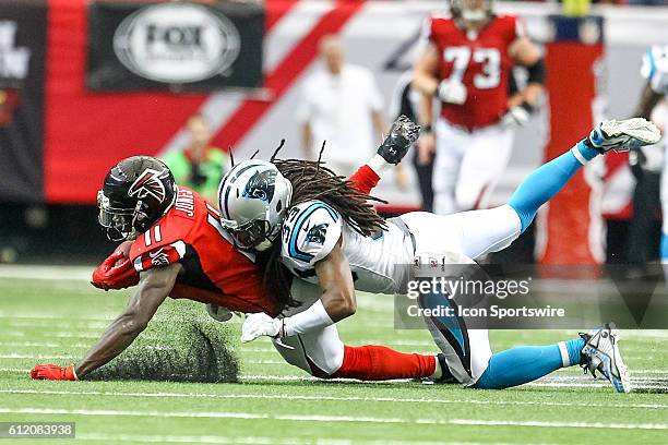 Carolina Panthers free safety Tre Boston tackles Atlanta Falcons wide receiver Julio Jones during the second half of the NFL game between the...