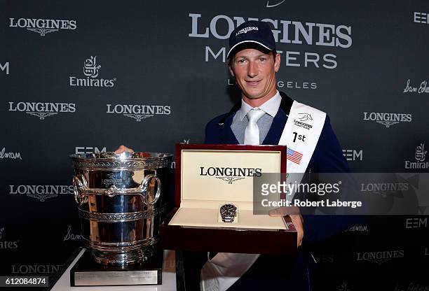 Daniel Deusser of Germany celebrates after winning during the Longines Grand Prix event at the Longines Masters of Los Angeles 2016 at the Long Beach...