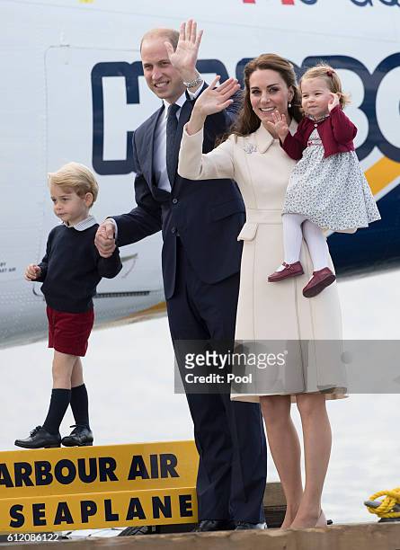 Prince William, Duke of Cambridge, Prince George of Cambridge, Catherine, Duchess of Cambridge and Princess Charlotte wave as they leave from...