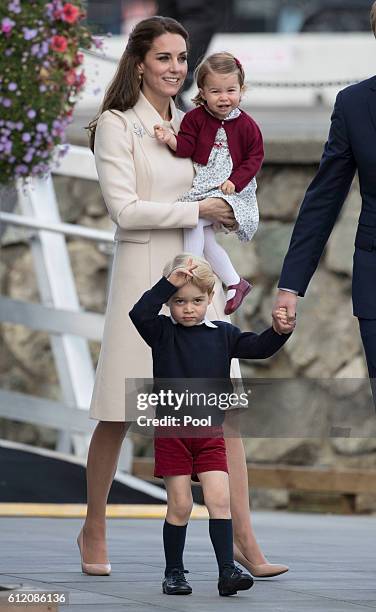 Prince William, Duke of Cambridge, Prince George of Cambridge, Catherine, Duchess of Cambridge and Princess Charlotte leave from Victoria Harbour to...