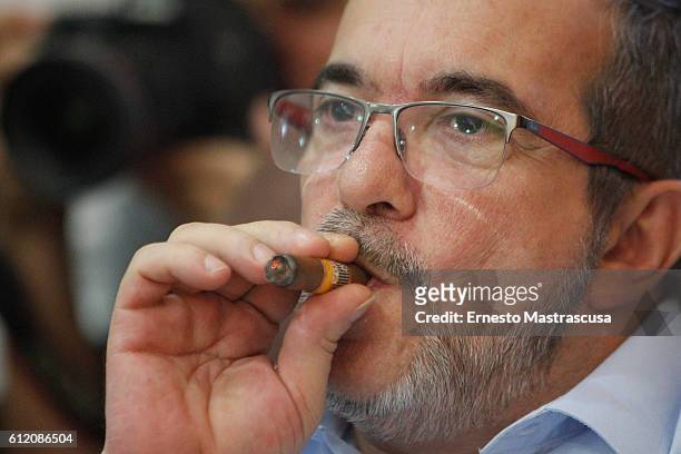 Rodrigo Londoño Echeverri, also known as Timochenko and Timoleón Jimenez, the top leader of the Revolutionary Armed Forces of Colombia, FARC, smokes...