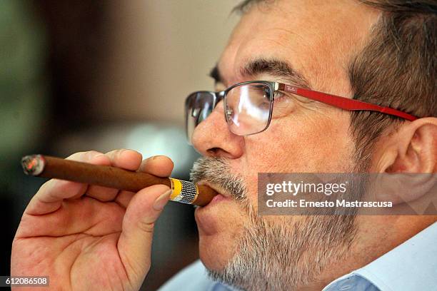 Rodrigo Londoño Echeverri, also known as Timochenko and Timoleón Jimenez, the top leader of the Revolutionary Armed Forces of Colombia, FARC, smokes...