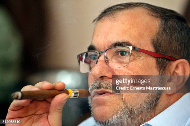 Rodrigo Londoño Echeverri, also known as Timochenko and Timoleón Jimenez, the top leader of the Revolutionary Armed Forces of Colombia, FARC, smokes...