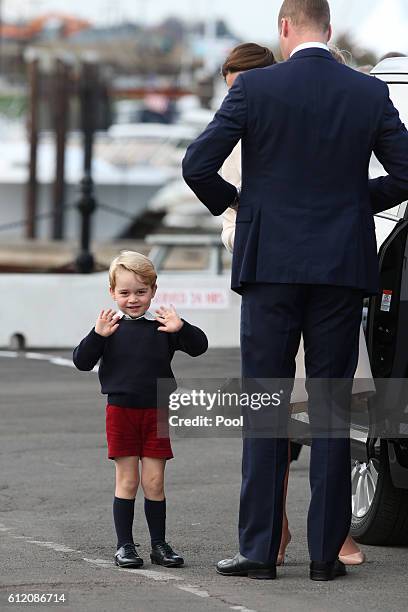 Prince George of Cambridge waves as he leaves from Victoria Harbour to board a sea-plane on the final day of their Royal Tour of Canada on October 1,...