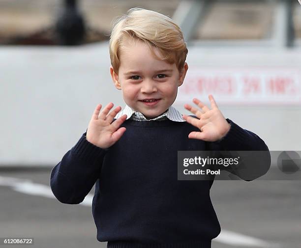 Prince George of Cambridge waves as he leaves from Victoria Harbour to board a sea-plane on the final day of their Royal Tour of Canada on October 1,...