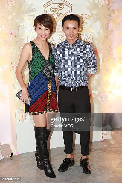 Actor Zhang Jin and wife actress Ada Choi attend actor Him Law and actress Tavia Yeung's wedding ceremony on October 2, 2016 in Hong Kong, China.