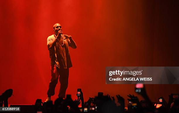 Kanye West performs on stage during The Meadows Music & Arts Festival on October 2, 2016 in Queens, New York. / AFP / ANGELA WEISS