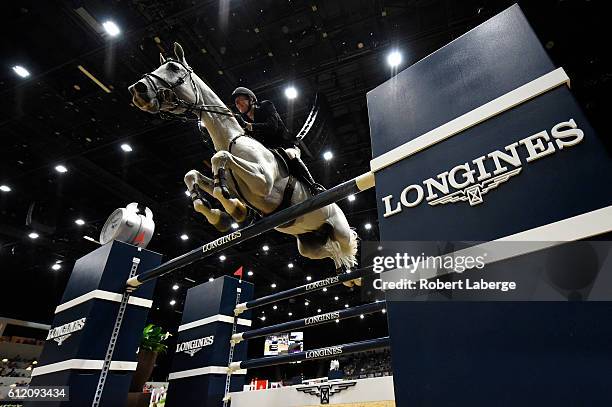 Jos Verlooy of Belgium competes during the Longines Grand Prix event at the Longines Masters of Los Angeles 2016 at the Long Beach Convention Center...