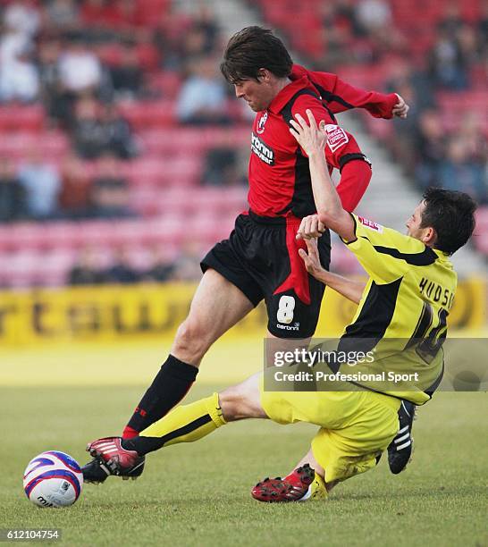 Darren Anderton of Bournemouth is tackled by Mark Hudson of Rotherham during the AFC Bournemouth v Rotherham United Coca-Cola Football League Two...