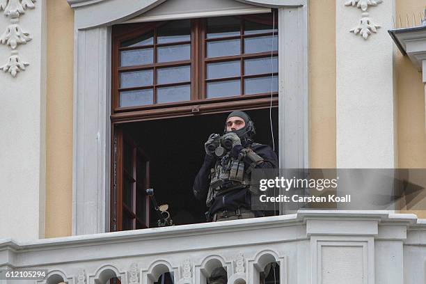 Snipers keep watch over the area during the celebrations to mark German Unity day on October 3, 2016 in Dresden, Germany. Unity Day, called Tag der...