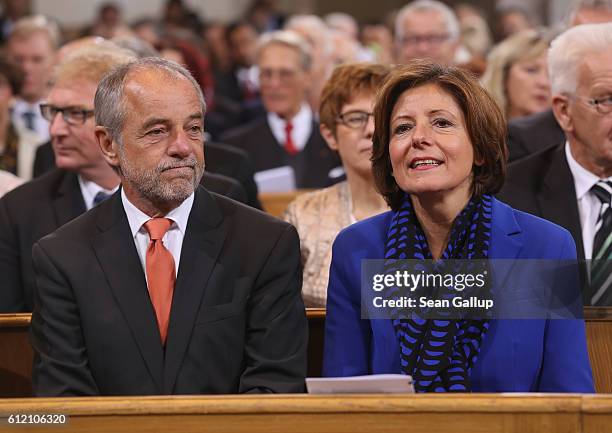 Governor of Rhineland-Palatinate Malu Dreyer and her husband Klaus Jensen arrive for a commemoratory service at the Frauenkirche church during...