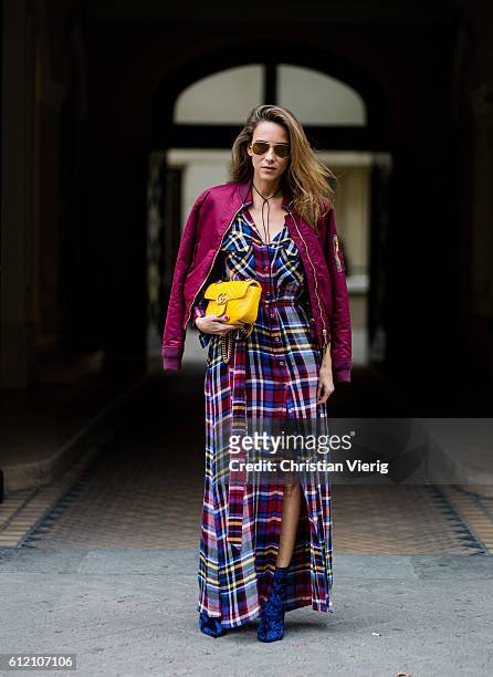 Fashion blogger and model Alexandra Lapp wearing a plaid dress from L'Agence, Schott NYC bomber jacket, Phillip Lim velvet boots, Ray Ban sunglasses,...