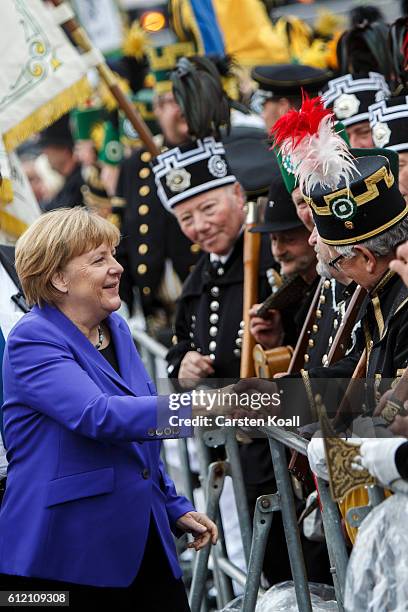 German Chancellor Angela Merkel greets visitors before the ceremony for celebrations to mark German Unity day on October 3, 2016 in Dresden, Germany....