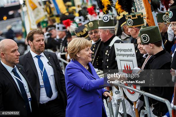 German Chancellor Angela Merkel greets visitors before the ceremony for celebrations to mark German Unity day on October 3, 2016 in Dresden, Germany....