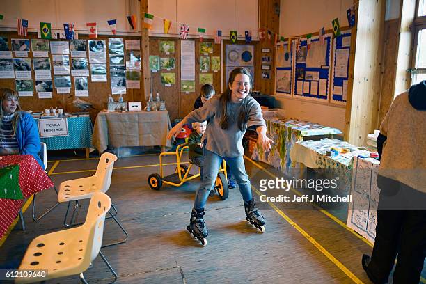 Fran Grear,trys out a pair of roller blades during the primary school coffee morning on the Island of Foula on September 30, 2016 in Foula, Scotland....