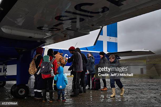 The plane arrives from Tingwall airport at the Island of Foula airstrip on September 28, 2016 in Foula, Scotland. Foula is the remotest inhabited...