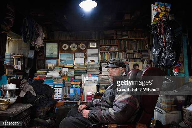 Seventy eight year old crofter Eric Ibister sits in his armchair at his home in Hametoun on the Island of Foula, September 30, 2016 in Foula,...