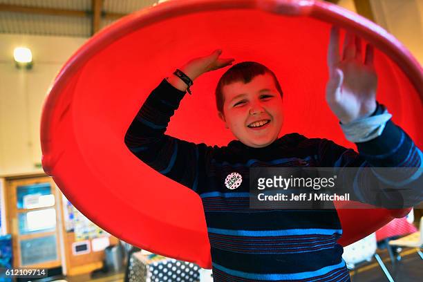 Jack Smith the only school child on the Island of Foula plays during the primary school coffee morning on September 30, 2016 in Foula, Scotland....