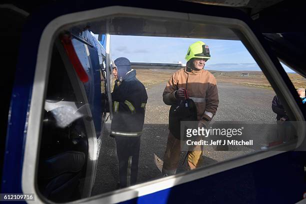 The Islander Aircraft is loaded with bags at the airstrip on the Island of Foula on October 3, 2016 in Foula, Scotland. Foula is the remotest...
