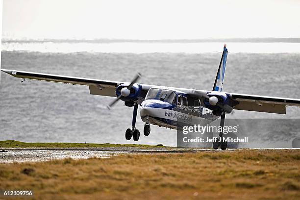 The Islander Aircraft land at the airstrip on the Island of Foula on September 29, 2016 in Foula, Scotland. Foula is the remotest inhabited island in...