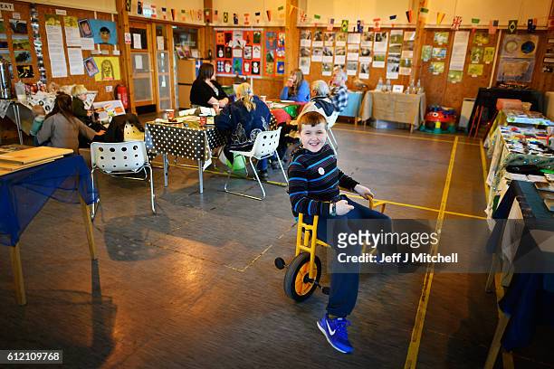 Jack Smith the only school child on the Island of Foula plays during the primary school coffee morning on September 30, 2016 in Foula, Scotland....