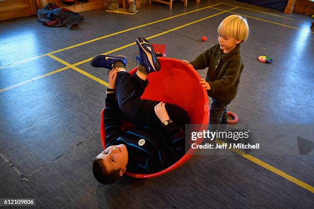 Jack Smith and Alfie Grear play during the primary school coffee morning on the Island of Foula, September 30, 2016 in Foula, Scotland. Foula is the...