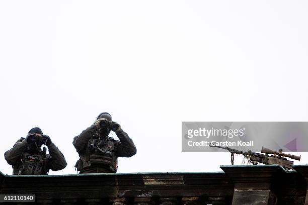 Snipers observe the celebrations to mark German Unity day on October 3, 2016 in Dresden, Germany. Unity Day, called Tag der Deutschen Einheit,...