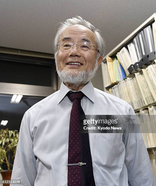 Yoshinori Osumi, a Tokyo Institute of Technology professor emeritus, speaks to reporters at the university's campus in Yokohama on Oct. 3 after...