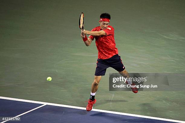 Kei Nishikori of Japan plays a backhand during the men's singles first round match against Donald Young of USA on day one of Rakuten Open 2016 at...