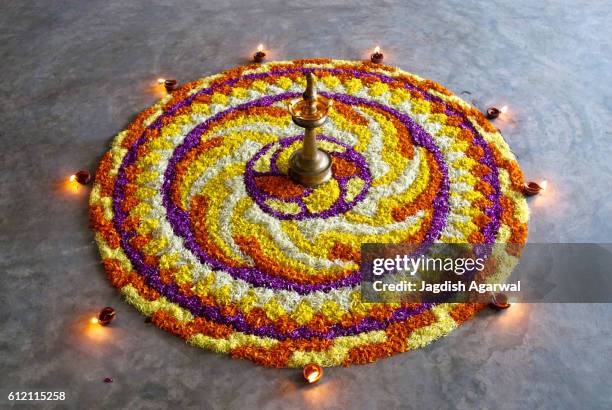 flower decoration for onam festival, kerala, india - rangoli stock-fotos und bilder