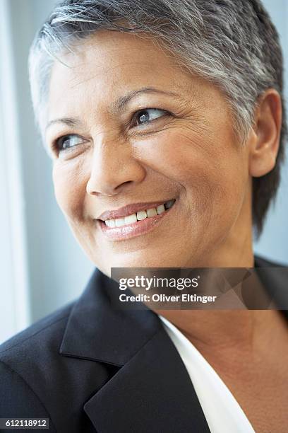 smiling businesswoman - oliver eltinger stock pictures, royalty-free photos & images
