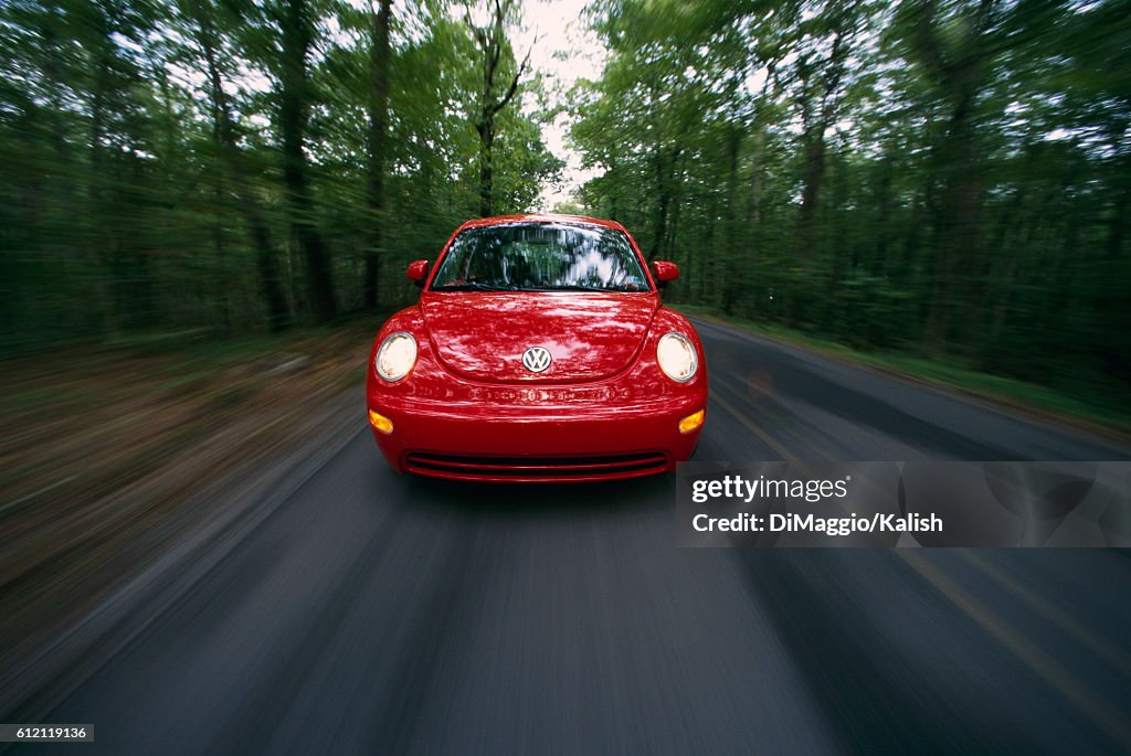 Volkswagen Bug Speeding Down Road