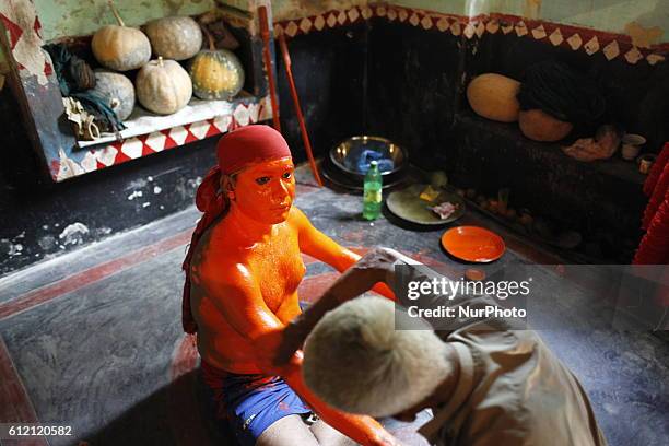 Last day of the bangle month the people of Munshiganj district Bangladesh do a warship of Hindu God Shiva praying for free from disease. In that day...