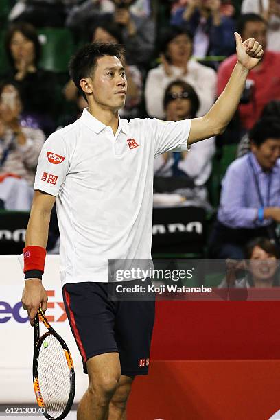 Kei Nishikori of Japan reacts to fans after winning the men's singles first round match against Donald Young of USA on day one of Rakuten Open 2016...