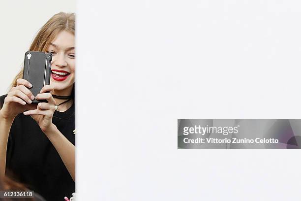 Model Gigi Hadid takes a selfie backstage prior the Giambattista Valli show as part of the Paris Fashion Week Womenswear Spring/Summer 2017 on...