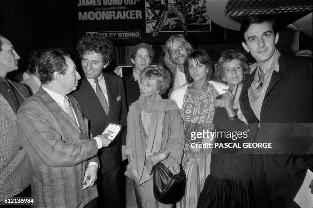 French screenwriter and film director Jean-Charles Tacchella , flanked by his wife chats with Culture minister Jack Lang next to French actors Robin...