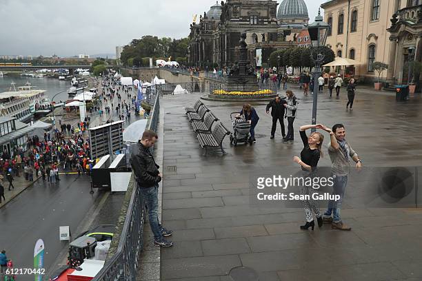 Couple dance to samba music during celebrations to mark German Unity Day on October 3, 2016 in Dresden, Germany. Unity Day, called Tag der Deutschen...