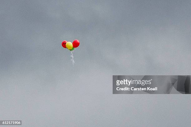 Balloons fly in the sky as people attend a ralley of right wing citizens movement "Festung Europa" on German Unity Day on October 3, 2016 in Dresden,...