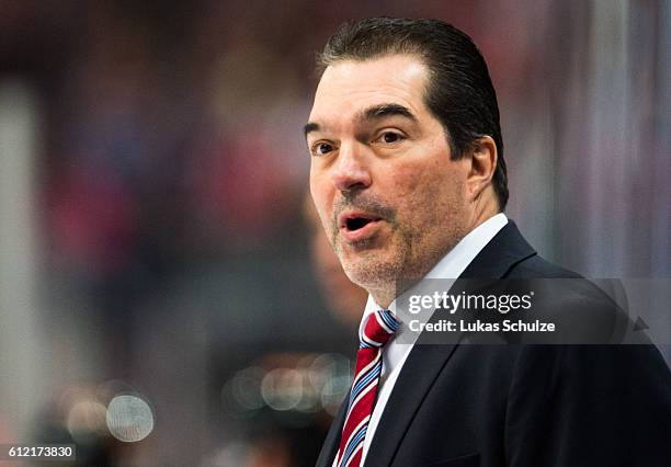 Head Coach Larry Mitchell of Straubing looks up during the DEL Ice Hockey match between Koelner Haie and Straubing Tigers at Lanxess Arena on October...