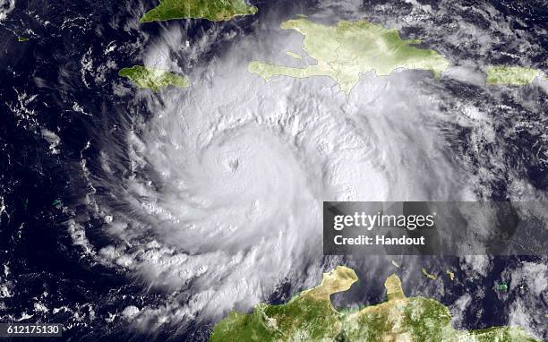 In this NOAA handout image, taken by the GOES satellite at 1620 UTC shows Hurricane Matthew in the Caribbean Sea heading towards Jamacia, Haiti and...